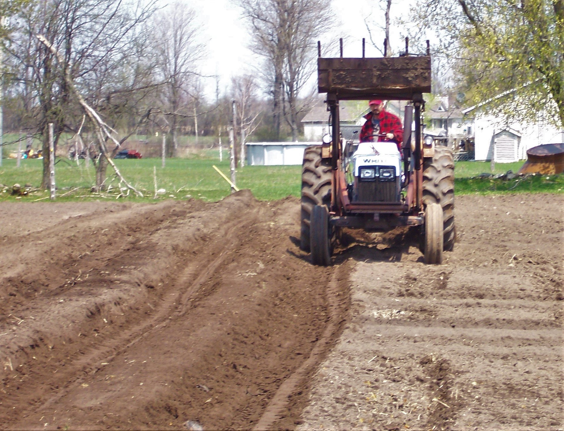 Tractor making raised beds